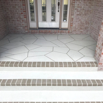 concrete steps of a porch accented with outdoor tiles