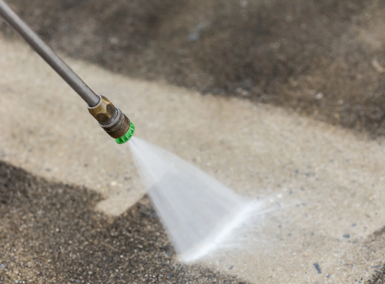 pressure washing device in an ongoing patio cleaning